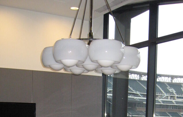 Modern chandelier with white globes.